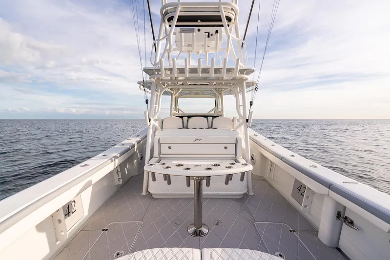  Yacht Photos Pics 2022 Yellowfin 42 boat on open water, showcasing spacious deck and seating.