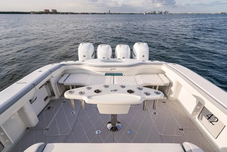  Yacht Photos Pics 2022 Yellowfin 42 boat with quad engines on open water.