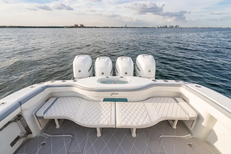  Yacht Photos Pics 2022 Yellowfin 42 boat with quad outboard engines on open water.