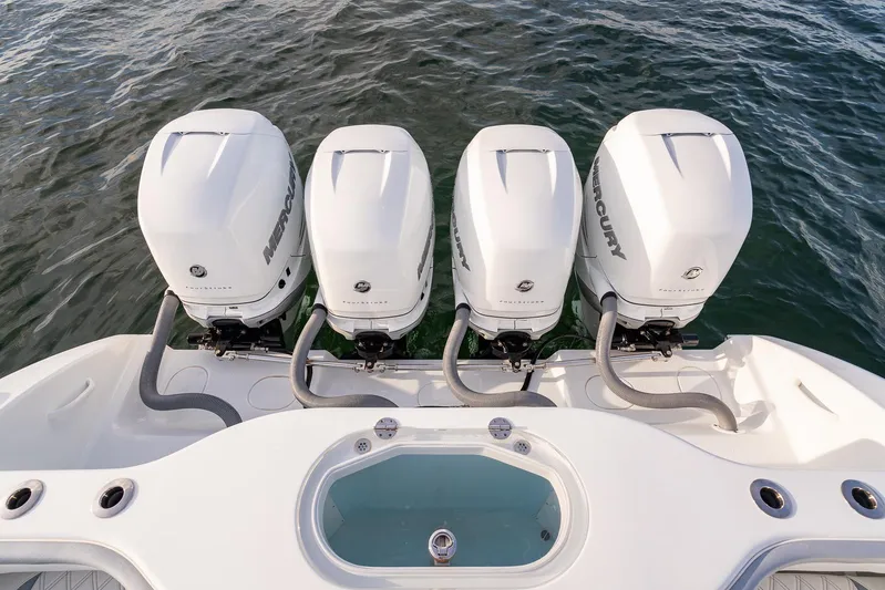  Yacht Photos Pics 2022 Yellowfin 42 boat with four Mercury outboard engines on water.