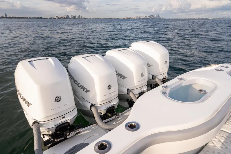  Yacht Photos Pics 2022 Yellowfin 42 boat with four Mercury outboard engines on the water.