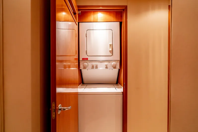 Determined Yacht Photos Pics Stacked washer and dryer in 2003 Hatteras 60 Convertible yacht interior.
