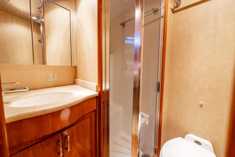 Determined Yacht Photos Pics Luxurious bathroom in 2003 Hatteras 60 Convertible yacht with shower and vanity.