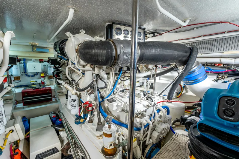 Determined Yacht Photos Pics Engine room of 2003 Hatteras 60 Convertible yacht, showcasing complex machinery and components.