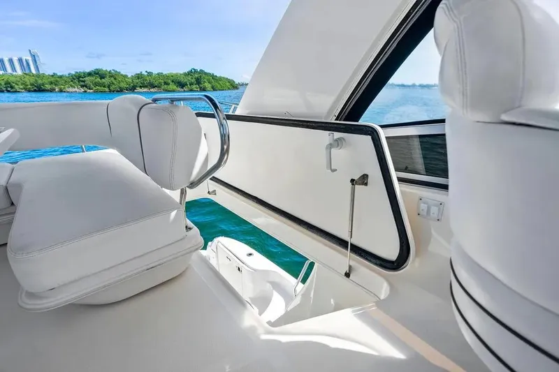 Megusta Yacht Photos Pics 2007 Sea Ray 44 Sedan Bridge interior with white seating and ocean view.