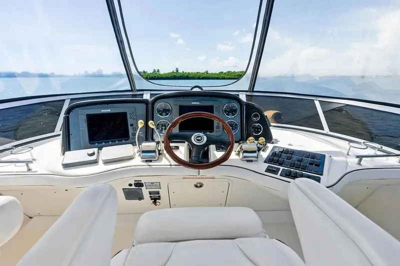 Megusta Yacht Photos Pics 2007 Sea Ray 44 Sedan Bridge helm with modern controls and panoramic view.