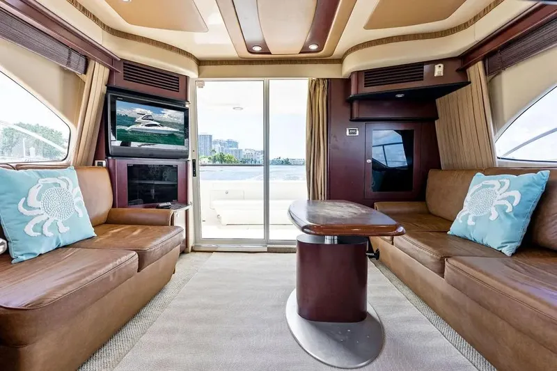 Megusta Yacht Photos Pics Luxurious interior of 2007 Sea Ray 44 Sedan Bridge yacht with leather seating and modern decor.