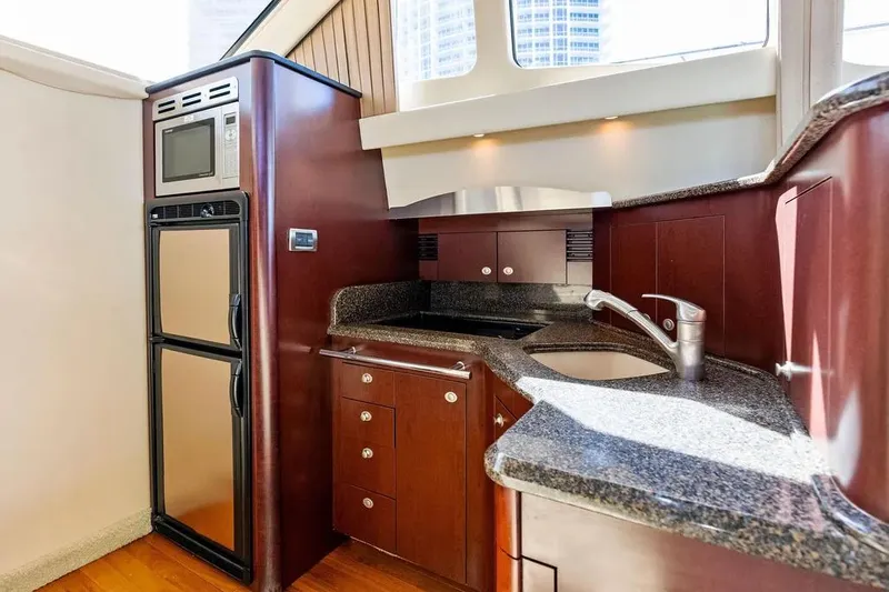 Megusta Yacht Photos Pics Luxurious kitchen area in 2007 Sea Ray 44 Sedan Bridge yacht with modern appliances.