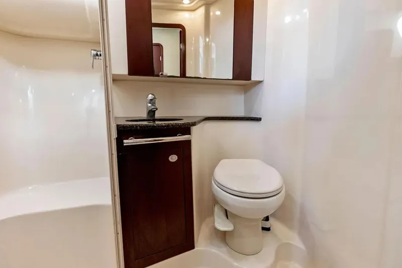 Megusta Yacht Photos Pics 2007 Sea Ray 44 Sedan Bridge bathroom with modern fixtures and wood accents.