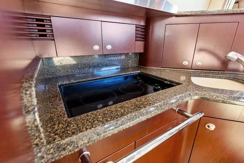 Megusta Yacht Photos Pics Luxurious kitchen area in 2007 Sea Ray 44 Sedan Bridge yacht with granite countertops.