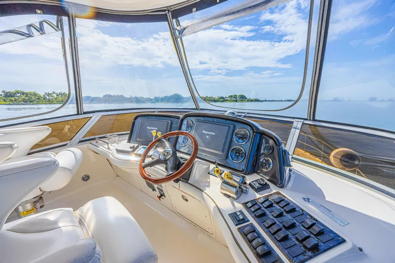 Megusta Yacht Photos Pics 2007 Sea Ray 44 Sedan Bridge helm with panoramic water view and modern controls.
