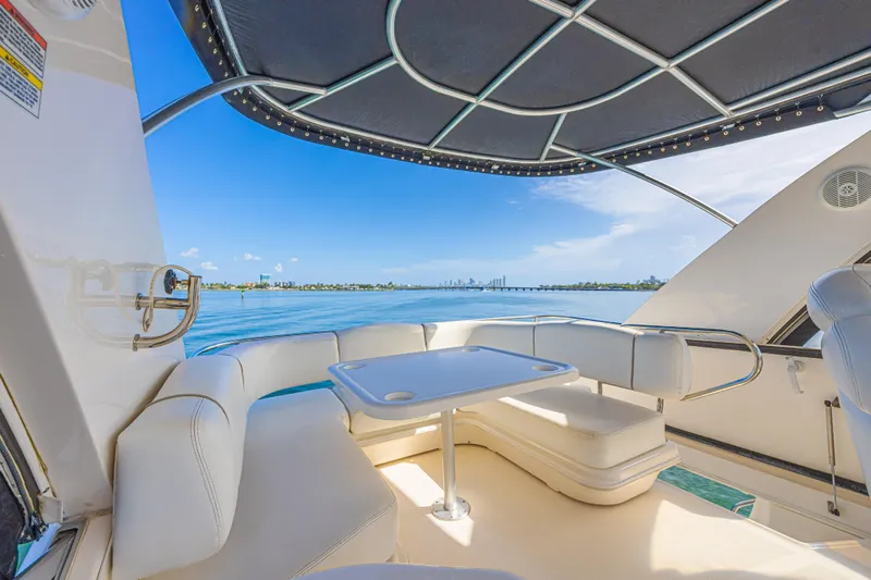 Megusta Yacht Photos Pics Luxurious 2007 Sea Ray 44 Sedan Bridge yacht interior with ocean view and seating area.