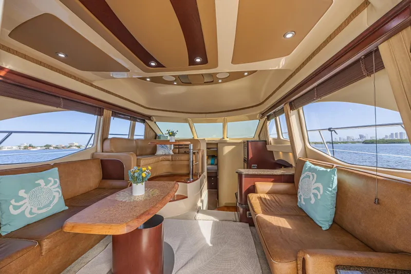 Megusta Yacht Photos Pics Luxurious interior of 2007 Sea Ray 44 Sedan Bridge yacht with elegant seating and scenic views.