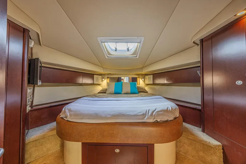 Megusta Yacht Photos Pics Luxurious 2007 Sea Ray 44 Sedan Bridge cabin interior with cozy bed and elegant wood finishes.