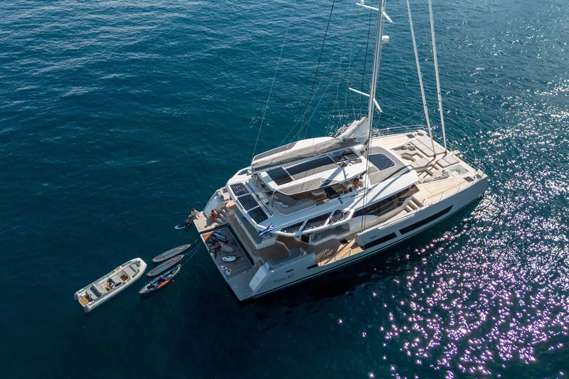 Serenissima III Yacht Photos Pics Luxury 2025 Fountaine Pajot Thira 80 yacht on serene blue ocean waters.