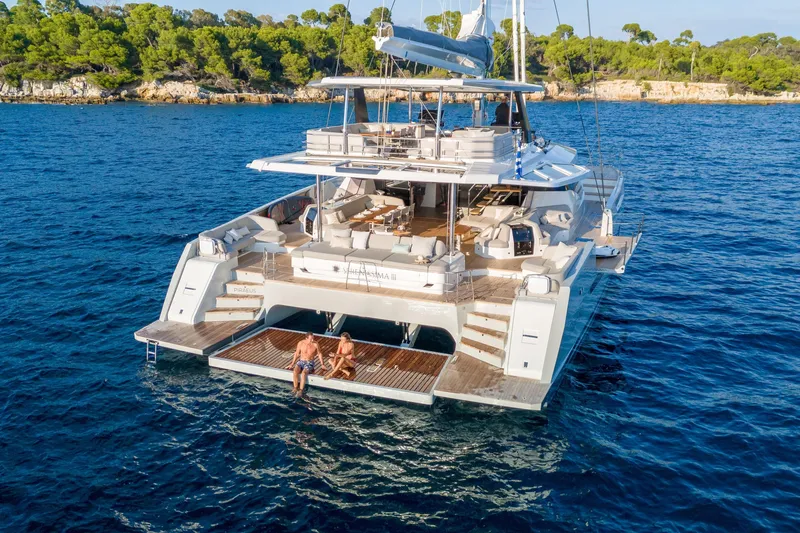 Serenissima III Yacht Photos Pics Luxury Fountaine Pajot Thira 80 yacht, 2025 model, anchored in serene blue waters.