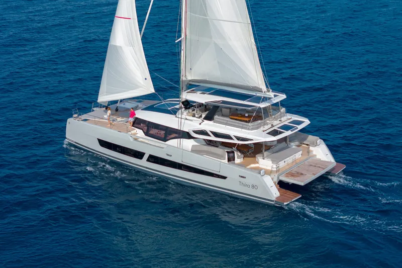 Serenissima III Yacht Photos Pics 2025 Fountaine Pajot Thira 80 sailing catamaran cruising on open blue sea.