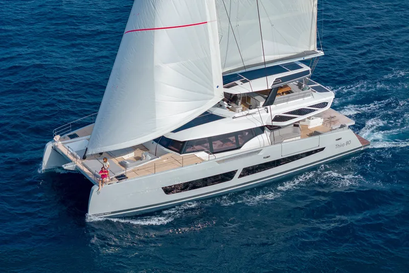 Serenissima III Yacht Photos Pics Luxury sailing catamaran Fountaine Pajot Thira 80, 2025 model, cruising on open sea.