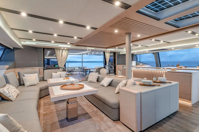 Serenissima III Yacht Photos Pics Luxurious interior of 2025 Fountaine Pajot Thira 80 yacht with modern design and ocean view.