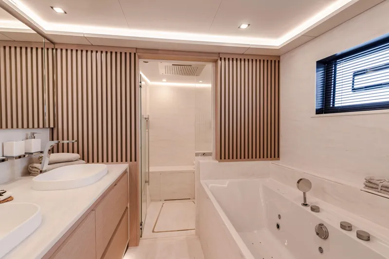 Serenissima III Yacht Photos Pics Luxurious bathroom in 2025 Fountaine Pajot Thira 80 yacht with modern fixtures and elegant design.