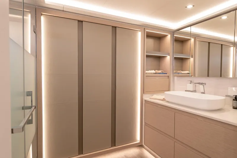 Serenissima III Yacht Photos Pics Luxurious bathroom interior of 2025 Fountaine Pajot Thira 80 yacht, featuring modern design.