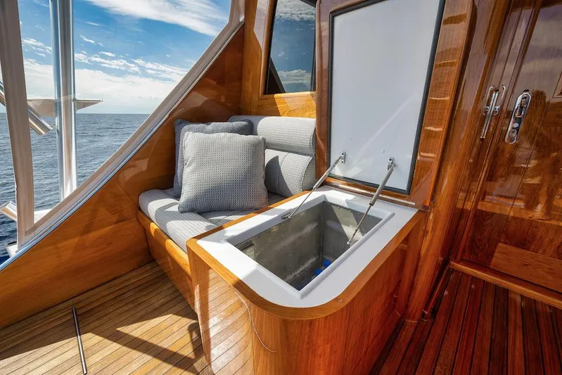 Bree Yacht Photos Pics Luxurious 2016 Merritt 86' yacht interior with cushioned seating and open storage compartment.