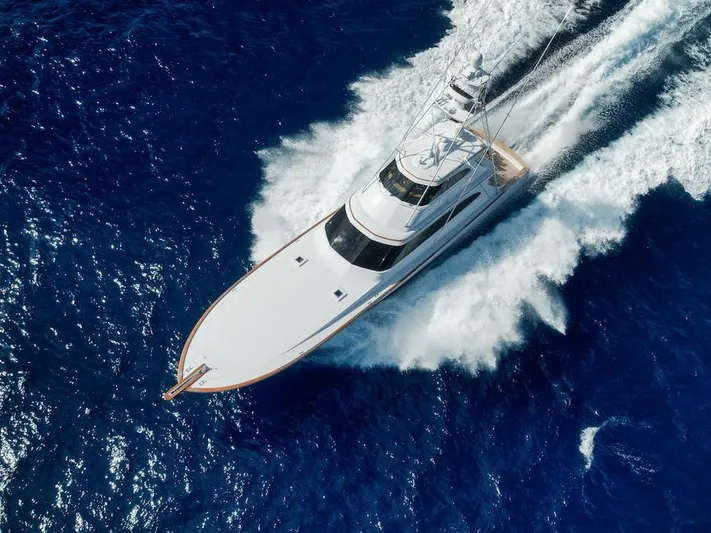 Bree Yacht Photos Pics Aerial view of 2016 Merritt 86' Enclosed Flybridge yacht cruising on blue ocean waters.