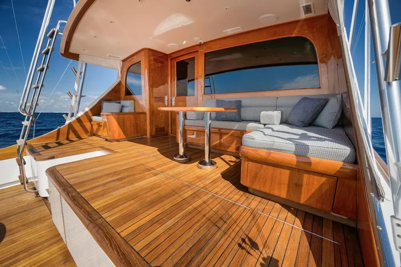 Bree Yacht Photos Pics Luxurious 2016 Merritt 86' Enclosed Flybridge yacht with elegant wooden deck and seating area.
