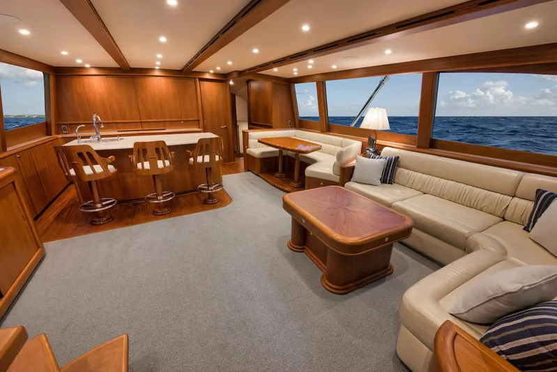 Bree Yacht Photos Pics Luxurious interior of 2016 Merritt 86' Enclosed Flybridge yacht with elegant wood finishes.