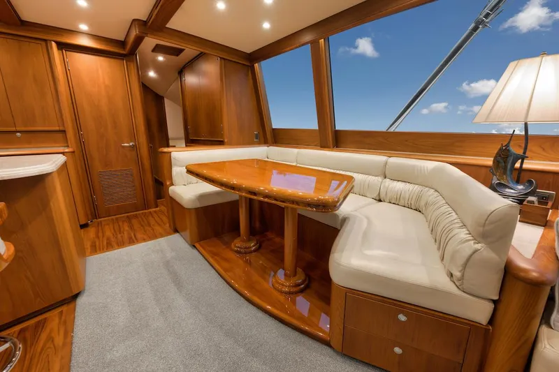 Bree Yacht Photos Pics Luxurious interior of 2016 Merritt 86' Enclosed Flybridge yacht with elegant wood finishes.