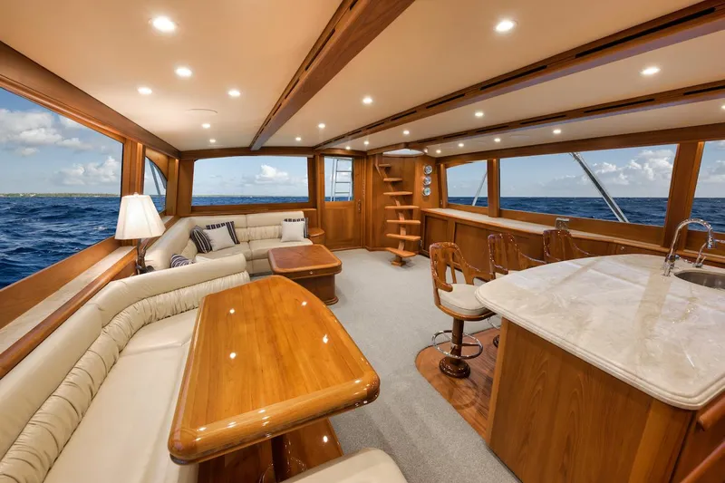 Bree Yacht Photos Pics Luxurious interior of 2016 Merritt 86' Enclosed Flybridge yacht with elegant wood finishes.