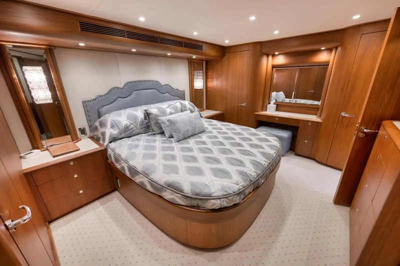 Bree Yacht Photos Pics Luxurious bedroom in 2016 Merritt 86' Enclosed Flybridge yacht with elegant wood finishes.