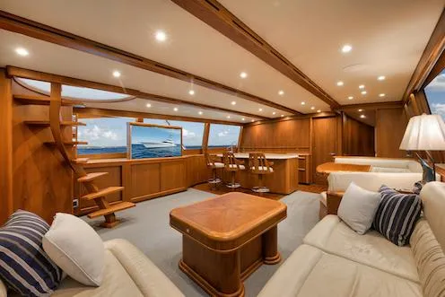 Bree Yacht Photos Pics Luxurious interior of 2016 Merritt 86' Enclosed Flybridge yacht with elegant wood finishes.