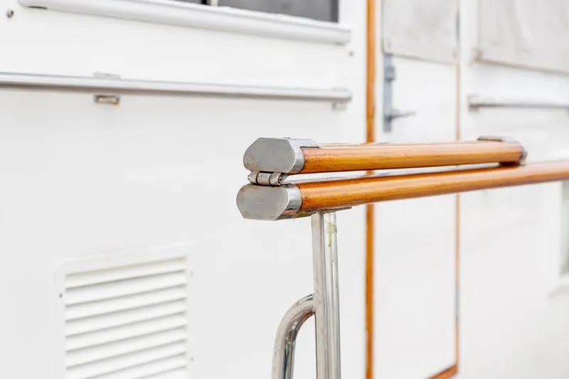 Sandy Isles Yacht Photos Pics Close-up of wooden railing on 1993 Grand Banks 46 Motoryacht, showcasing craftsmanship and design.