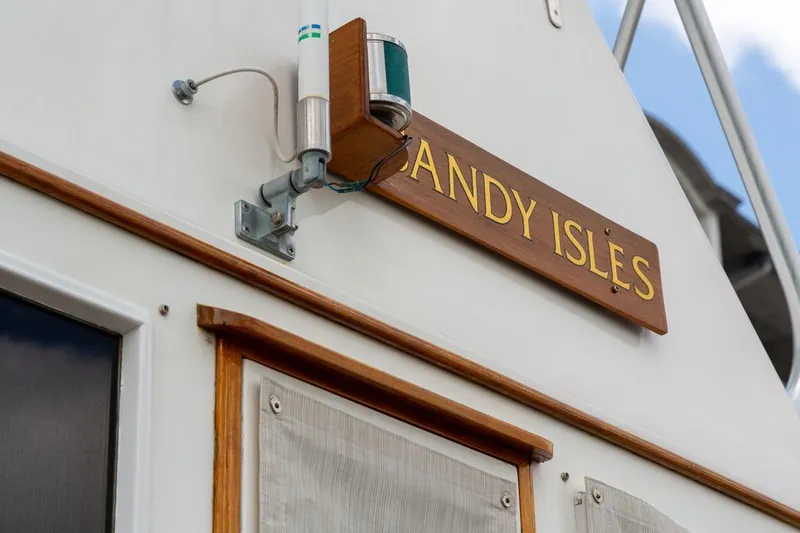 Sandy Isles Yacht Photos Pics 1993 Grand Banks 46 Motoryacht with "Sandy Isles" nameplate and navigation light.