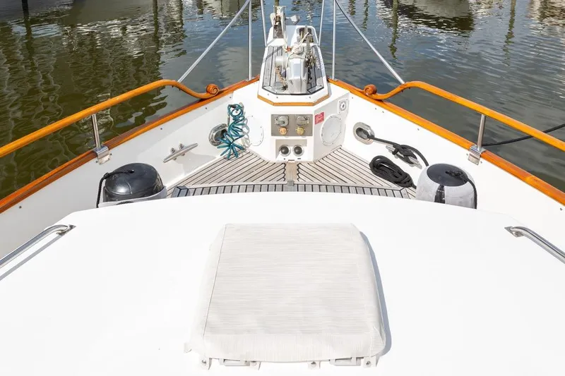 Sandy Isles Yacht Photos Pics Bow view of 1993 Grand Banks 46 Motoryacht with teak deck and marine equipment.