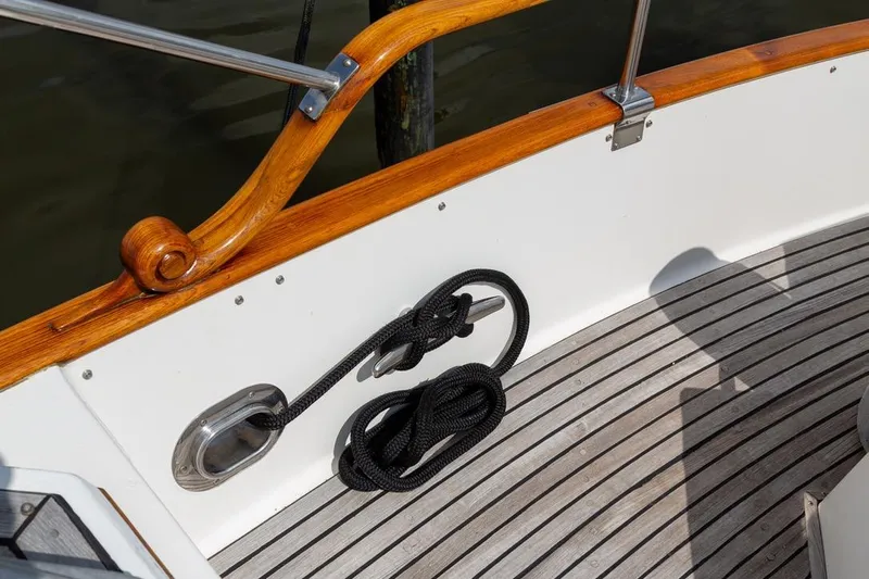 Sandy Isles Yacht Photos Pics Deck detail of 1993 Grand Banks 46 Motoryacht with polished wood and coiled rope.