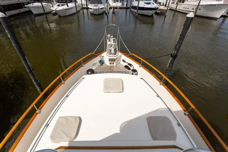 Sandy Isles Yacht Photos Pics Bow view of 1993 Grand Banks 46 Motoryacht docked at marina.