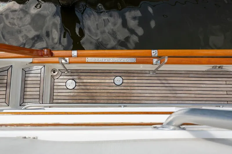 Sandy Isles Yacht Photos Pics Deck of 1993 Grand Banks 46 Motoryacht with wooden finish and metal fittings.