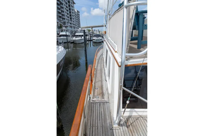 Sandy Isles Yacht Photos Pics Side view of 1993 Grand Banks 46 Motoryacht docked at marina.