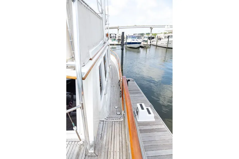 Sandy Isles Yacht Photos Pics Side view of 1993 Grand Banks 46 Motoryacht docked at marina.