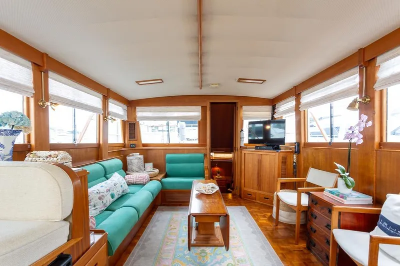 Sandy Isles Yacht Photos Pics Luxurious interior of 1993 Grand Banks 46 Motoryacht with elegant wood finish and comfortable seating.