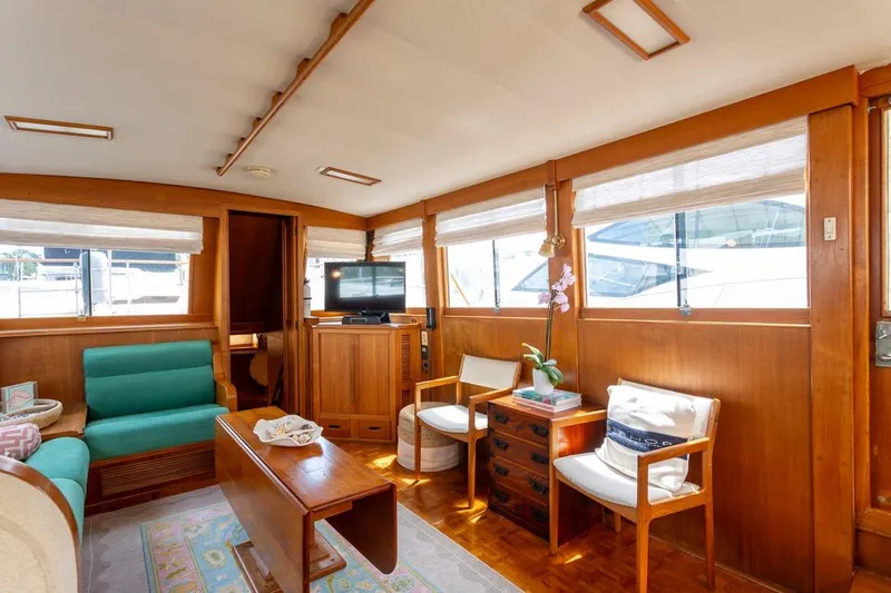 Sandy Isles Yacht Photos Pics Interior of 1993 Grand Banks 46 Motoryacht with wooden decor and comfortable seating.