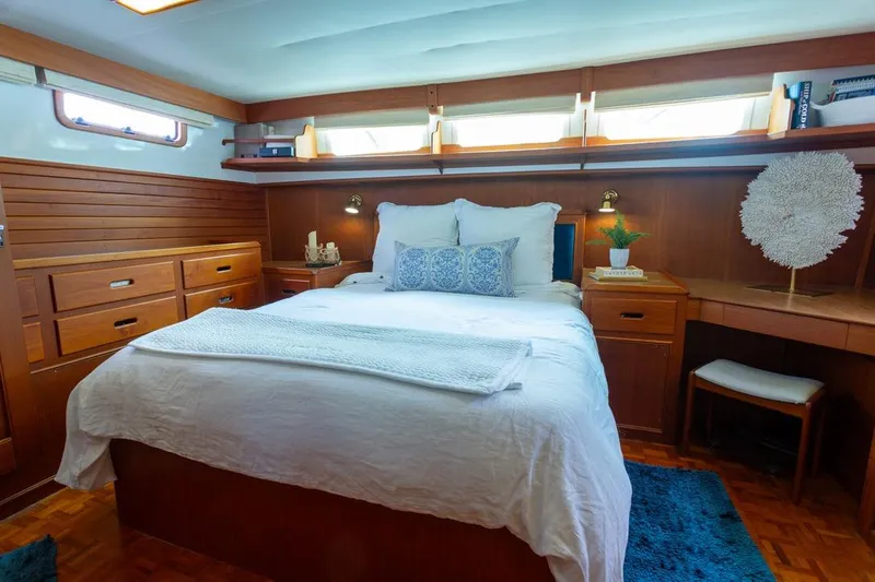 Sandy Isles Yacht Photos Pics Luxurious cabin interior of 1993 Grand Banks 46 Motoryacht with elegant wood finish.