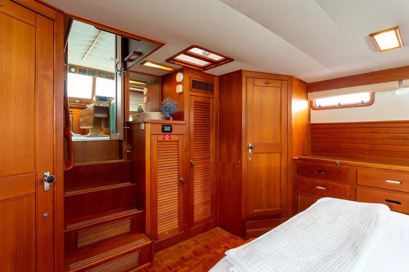 Sandy Isles Yacht Photos Pics Interior of 1993 Grand Banks 46 Motoryacht with wooden cabinetry and cozy furnishings.