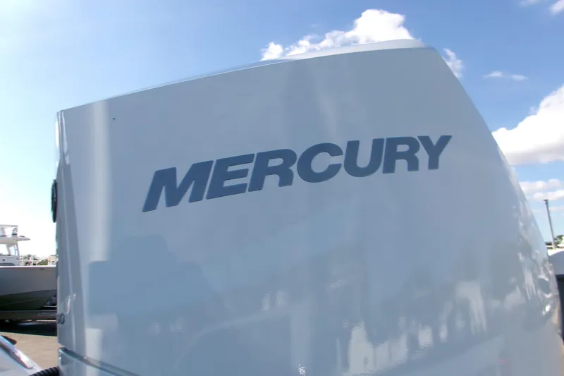  Yacht Photos Pics Mercury outboard engine on 2026 Monterey Elite 25 OB boat under blue sky.