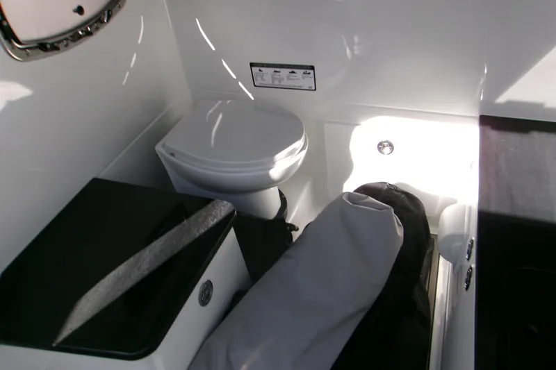  Yacht Photos Pics Interior of 2026 Monterey Elite 25 OB boat featuring a compact bathroom area.