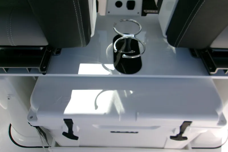  Yacht Photos Pics 2026 Monterey Elite 25 OB boat interior with seating and storage compartment.