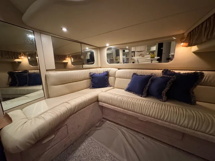 Castaways Yacht Photos Pics Luxurious interior of 2000 Sea Ray 380 Sundancer with plush seating and elegant decor.
