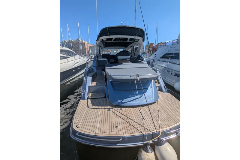  Yacht Photos Pics 2016 Cranchi M 44 HT yacht docked at marina, rear view.